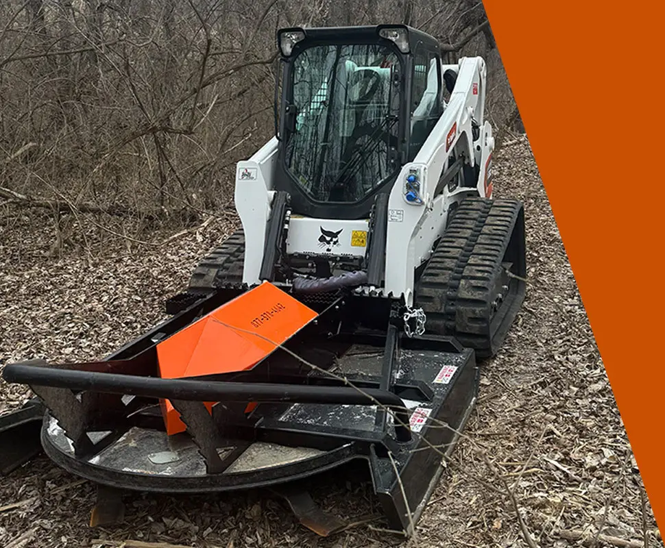Bobcat loader with Brushcat rotary cutter attachment
